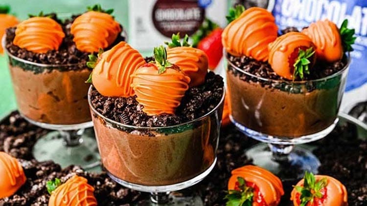 Carrot Patch Dirt Cups shown made according to the recipe and ready to be served and enjoyed.