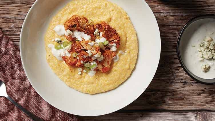 Buffalo Cauliflower over White Cheddar Parmesan Grits
