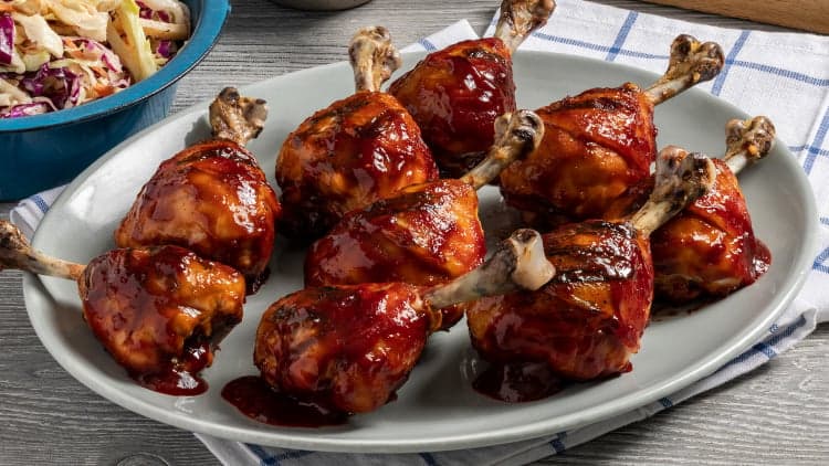 Bell & Evans Chicken Drumstick Lollipops shown cooked using their Raspberry BBQ Chicken Lollipops recipe, ready to be enjoyed.